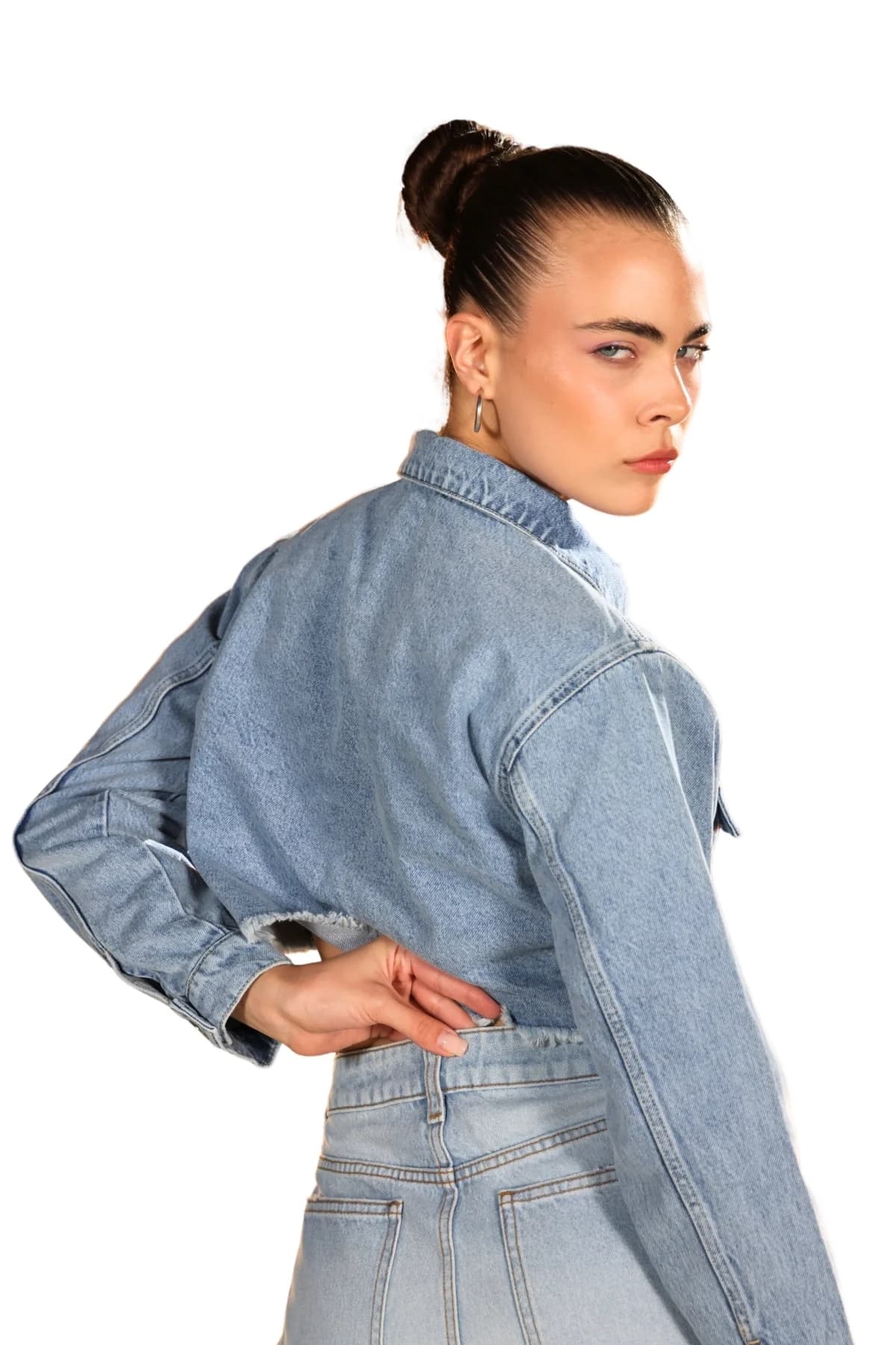 Denim Moon women's light blue denim shorts with high waist and back pocket detail, close-up back view on model.
