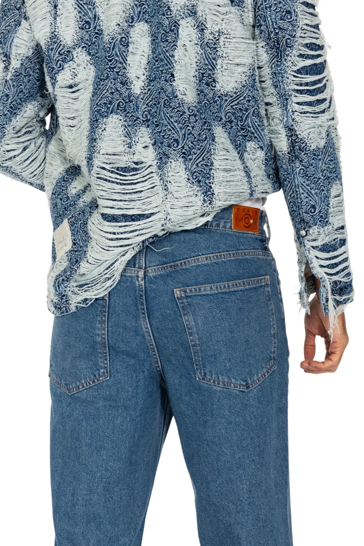 Denim Moon men's blue paisley denim shirt with distressed texture and sleeve detail, close-up back view on model.