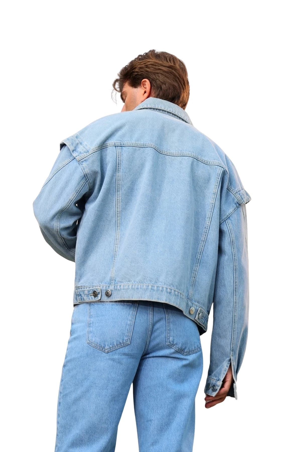 Denim Moon men's light blue relaxed-fit denim jacket with dropped shoulders and back seam details, three-quarter back view on model.
