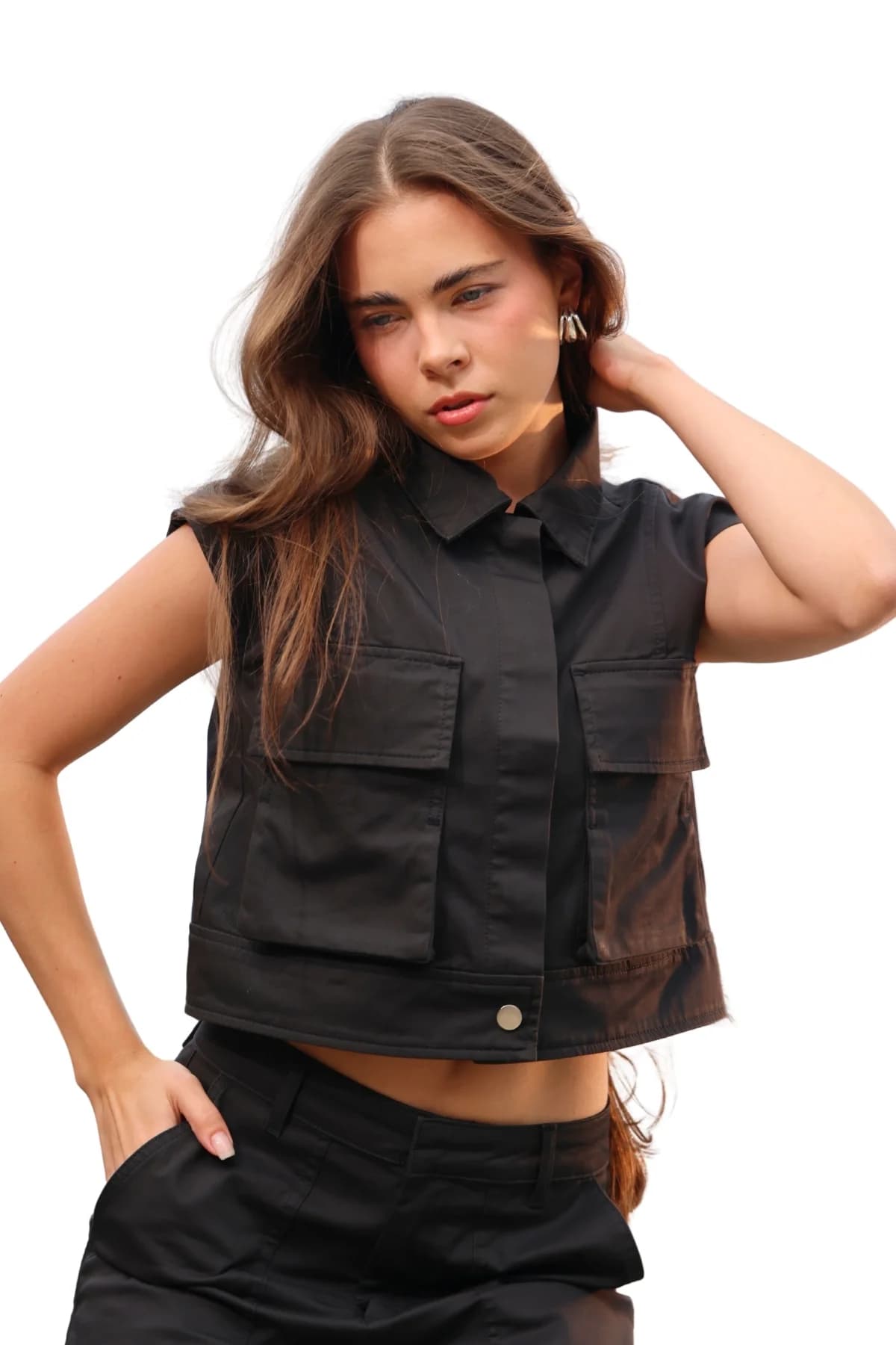 Denim Moon women's black cropped woven vest with flap pocket and snap detail, close-up front view on model.