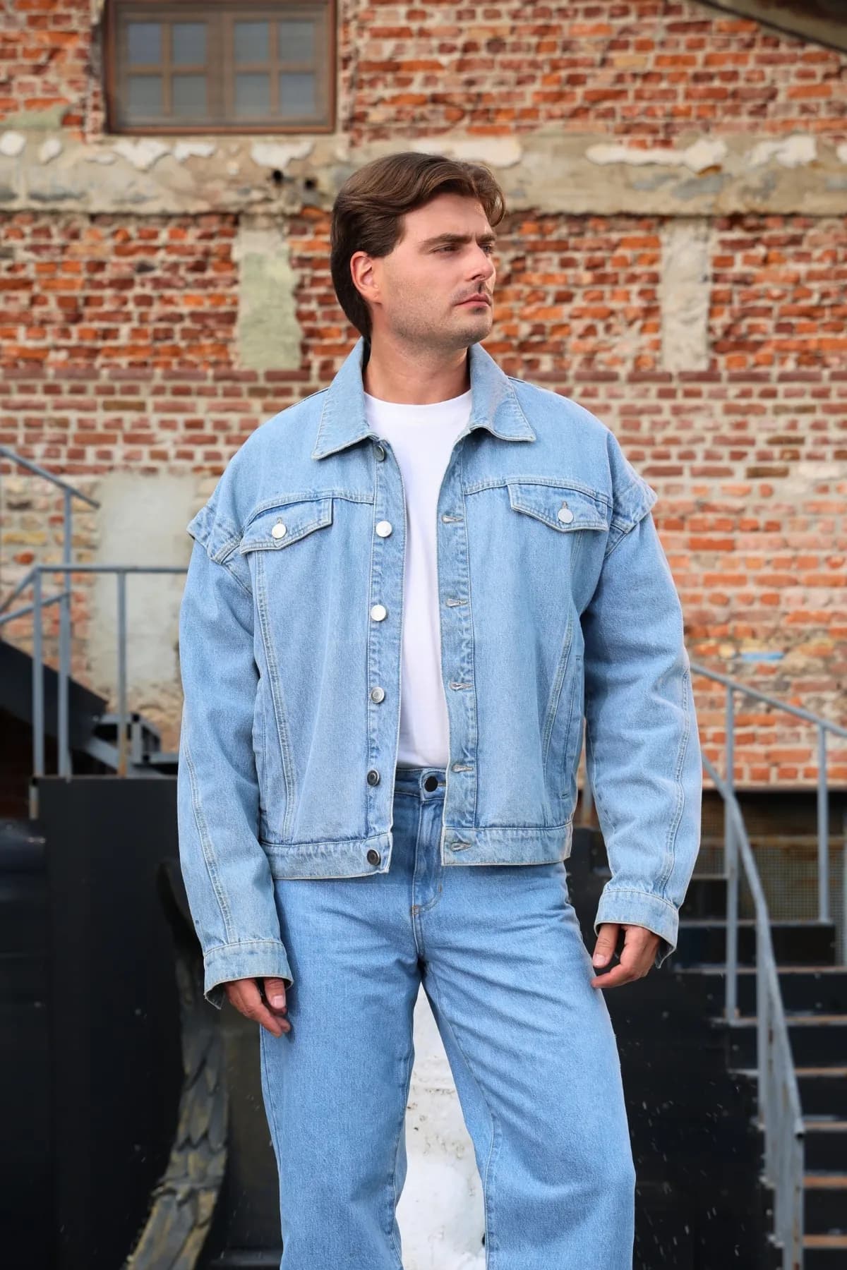 Denim Moon men's light wash drop-shoulder oversize denim jacket, full front view on model.