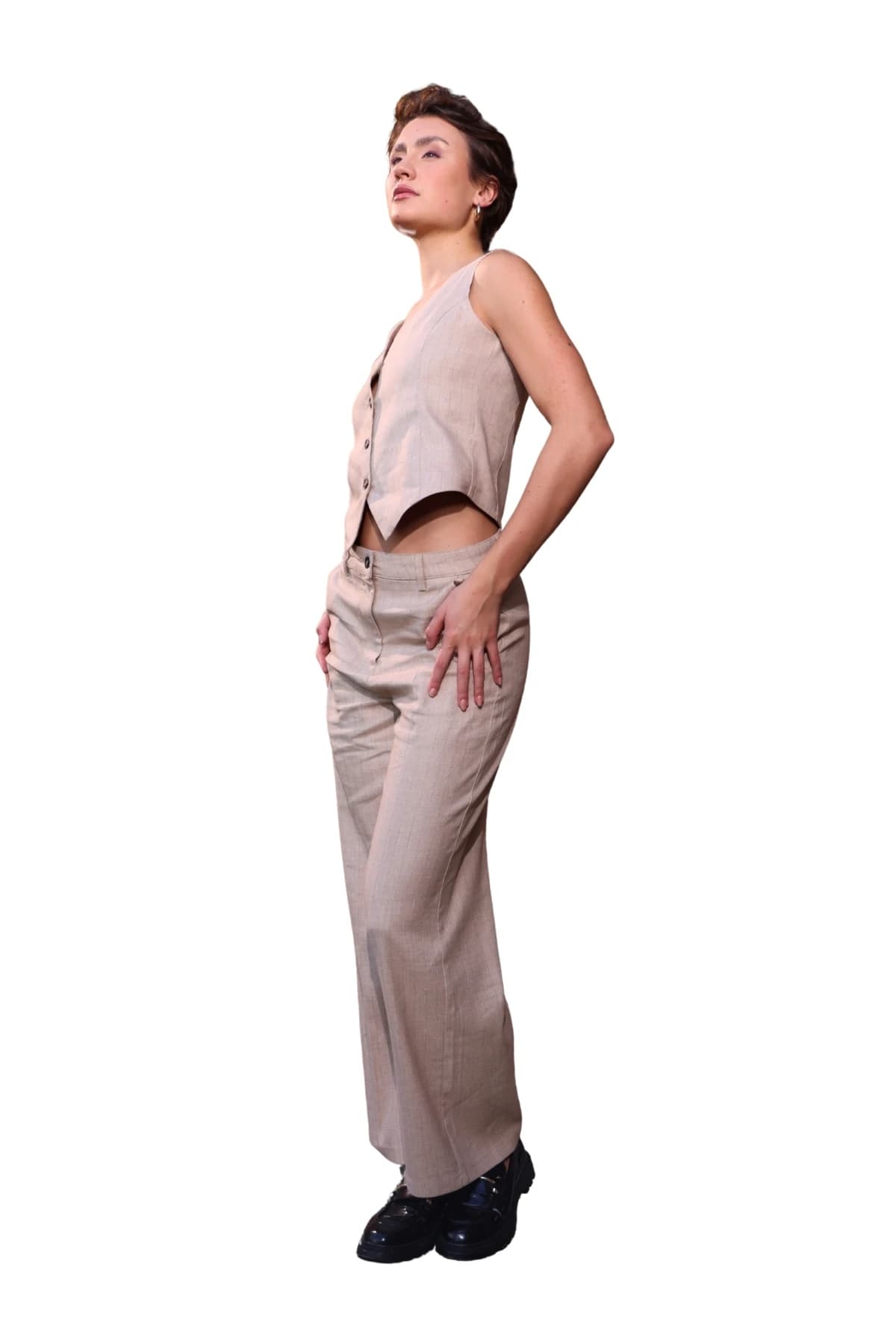 Denim Moon women's beige woven vest with a pointed cropped hem, full-length three-quarter front view on model.