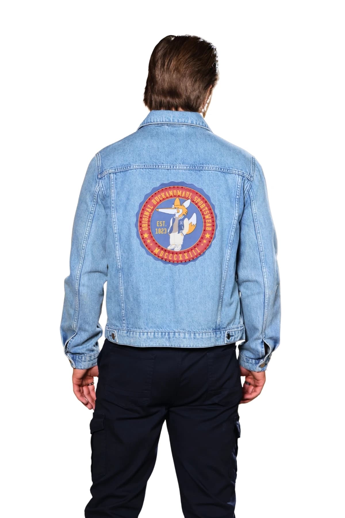 Denim Moon men's light blue denim jacket with back badge print and waistband, back view on model.