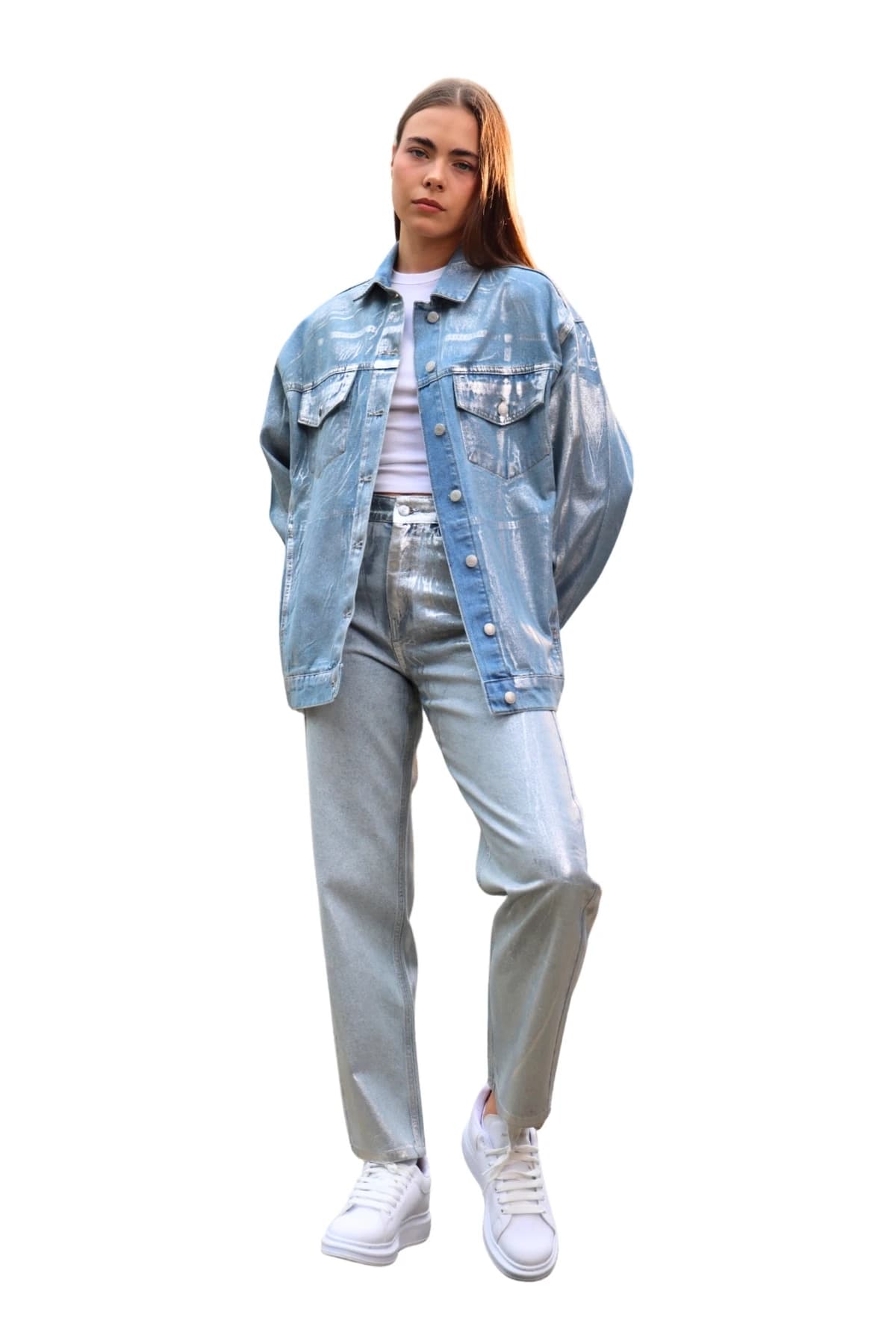 Denim Moon women's blue denim jacket with silver metallic coating, an oversized fit and flap chest pockets, full-length front view on model.